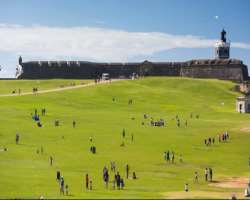 There is a big lawn outside the castle and the visitors have to cross this to reach the castle.